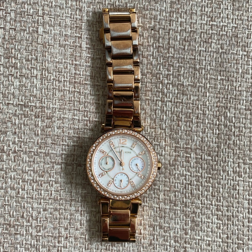 Michael Kors rose gold watch.